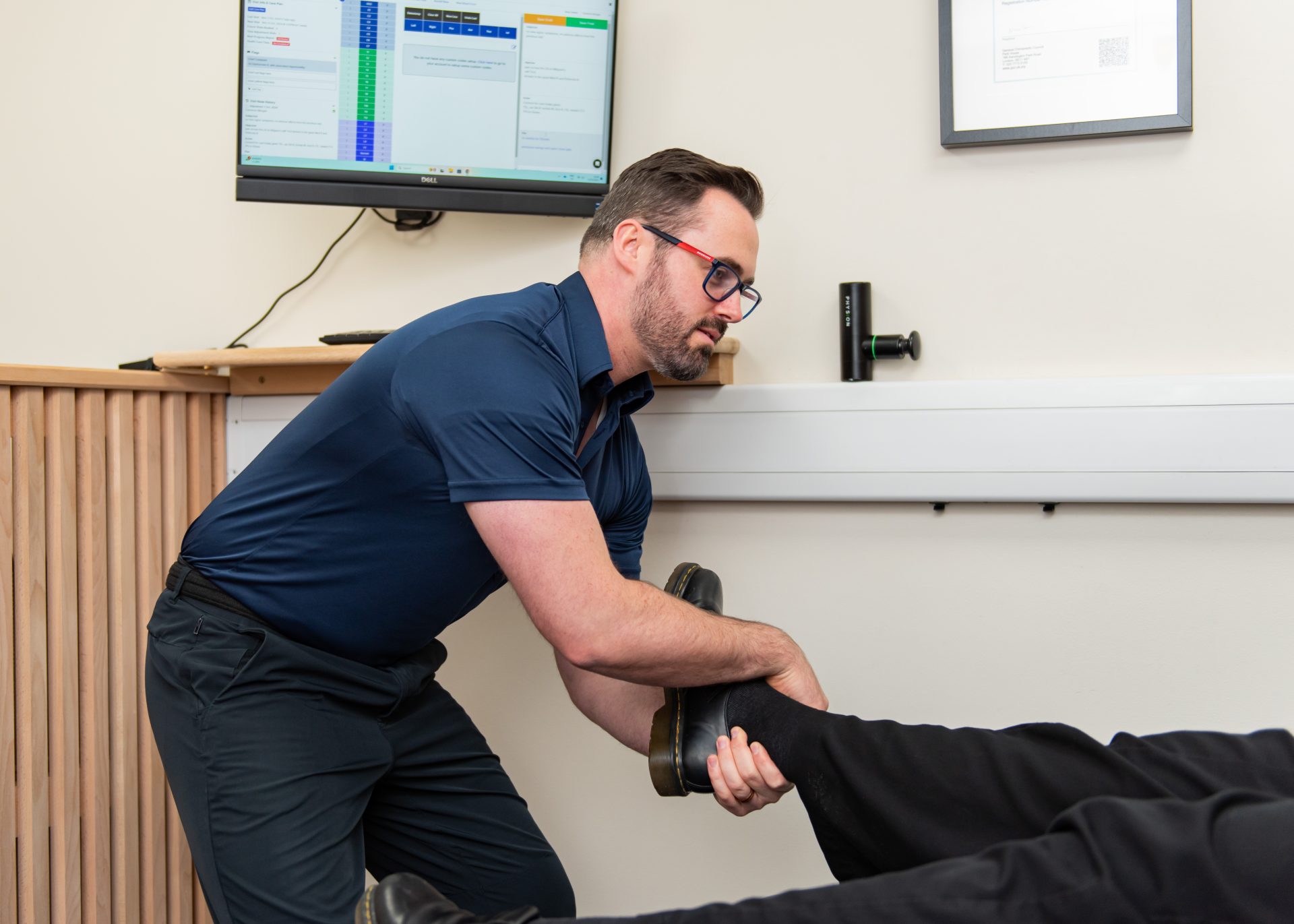 Chiropractor treating patient