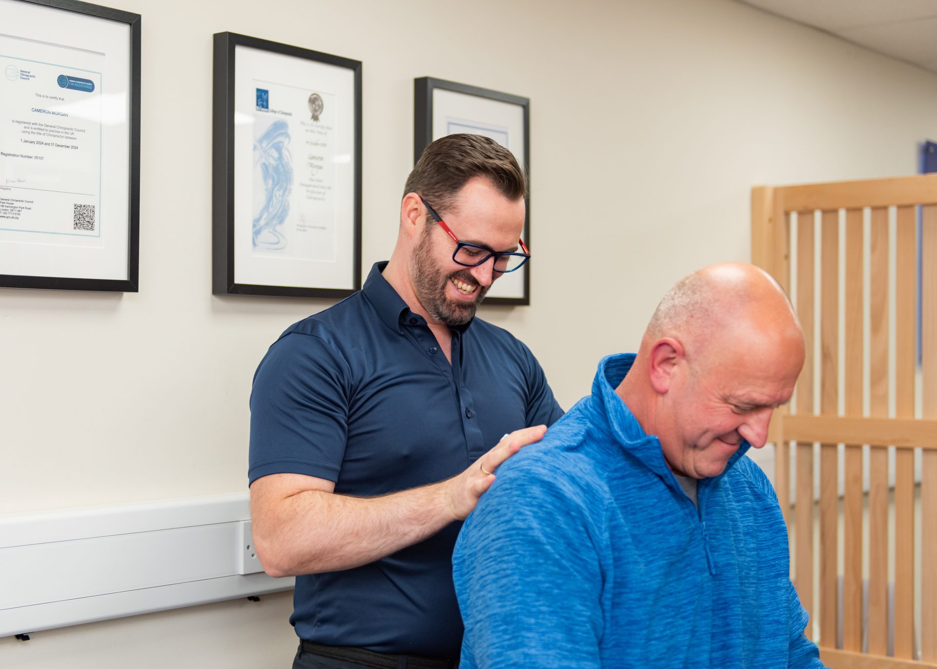 Therapist adjusting a patient's spine in a wellness clinic